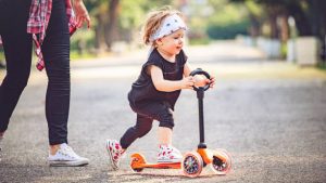 Little kid enjoying their scooter