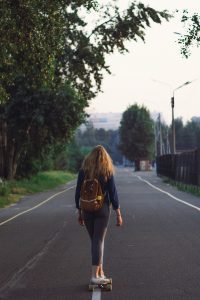 Skateboard: A person on a skaterboard down an empty road, capturing the essence of skateboarding. The scene evokes a sense of freedom and the simple joy of taking a journey on a skateboard.