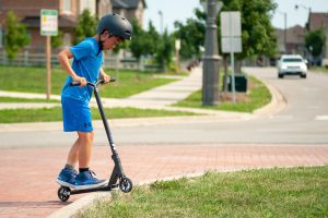 A child riding a scooter