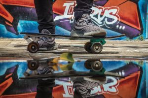skateboarder on a skateboard, guide of essential skateboard accessories to buy.