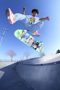 An expert skateboarder using a board for professional skater while practicing his tricks. 