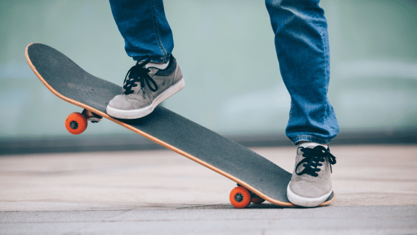 Someone doing tricks on a skateboard. Safety should always be your top priority when skateboarding.