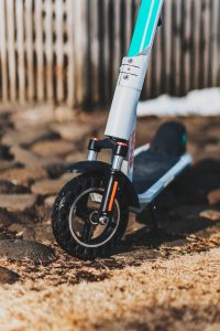  A clean scooter with a mudguard on its front wheel. 