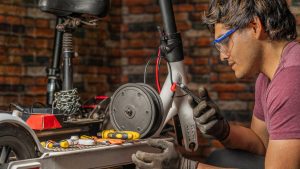 A focused man performing maintenance tasks with dedication.