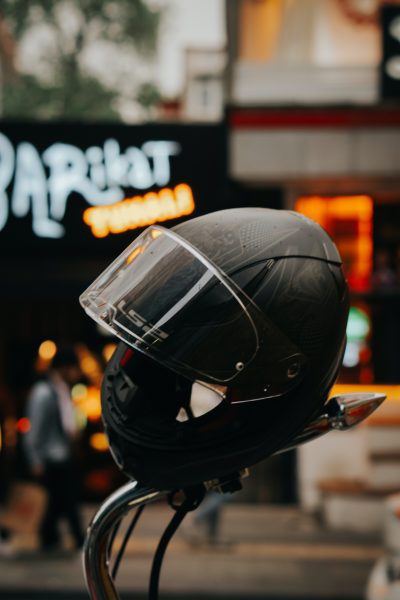 A black helmet for head protection and security of riders while on their scooter adventure. 