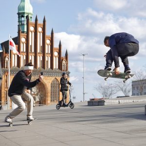 3 men in a skate park having fun for coordination