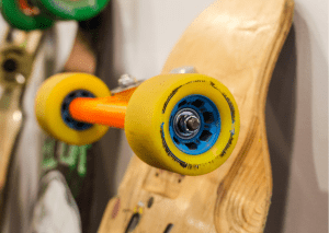 Skateboard's wheel - This is a picture of a zoomed yellow longboard. 