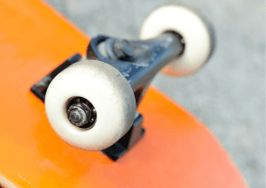 A plain longboard with white tires. 