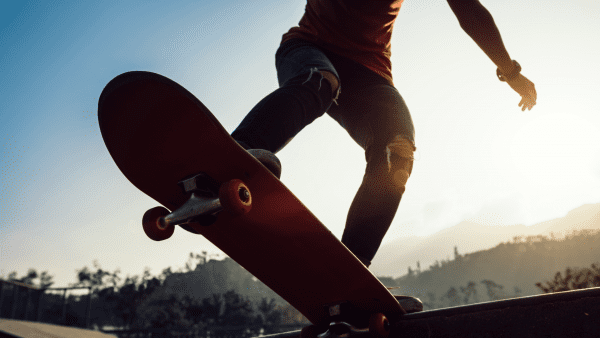 Skateboard review from experts skaters: A man skateboarding.in the skate park using his skateboard protective gear - this is the safest way to protect yourself when skating in the skate park or in the streets. Safe skating!