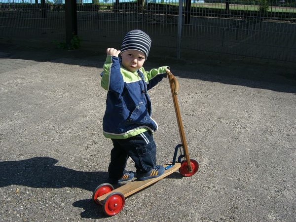 A toddler with a scooter