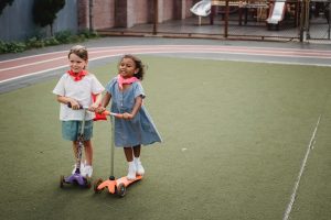 Kids scootering.