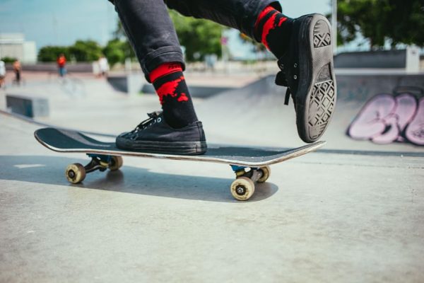 A man is using an old type of board for his sport. 