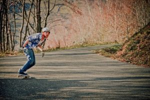 A person skateboarding outdoors for their well-being.