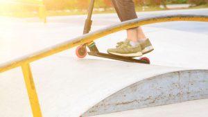 a person's feet confidently positioned on the scooter, showcasing their impressive sense of balance.