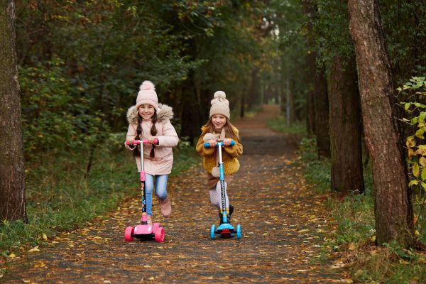 scooter buddies! children on a scooter ride. using a scooter to exercise is fun. grab a scooter today!