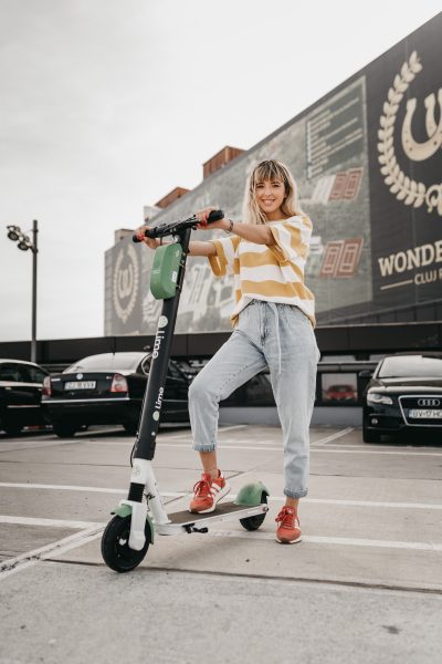 Woman on her e-scooter. 