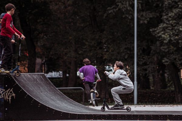 Kids doing tricks on a ramp