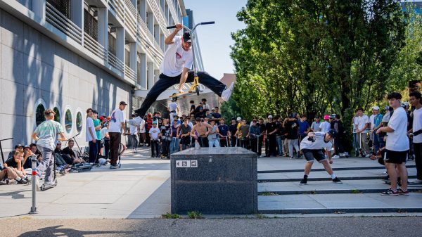 A man doing scooter stunts