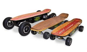 Three custom skateboards with off-road wheels, featuring unique wood designs and custom brand logos.
