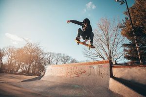 Skateboarder on a skate park.