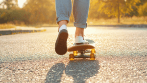 weatherproofing your beloved skateboard: A yellow skateboard, reminiscent of a sunbeam gliding across the pavement, boasts an elongated skateboard deck crafted from resilient bamboo or maple. Its vibrant hue radiates energy and positivity, drawing attention as it cruises effortlessly along coastal boulevards under a nice weather.