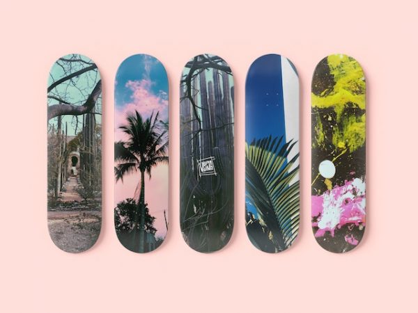 Build five skateboards deck on a pink background
