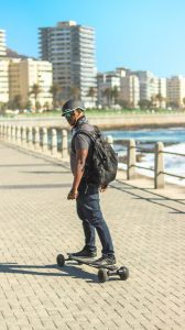 Riding with his skateboard