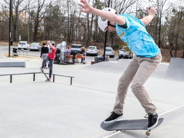 Riders practicing in the park with ramps