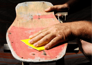 A person doing a DIY fixing of his board 