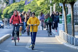 Woman riding electric scooter