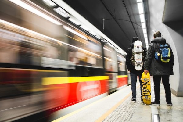 A man wearing a skateboard backpack showcasing the skateboarding culture.