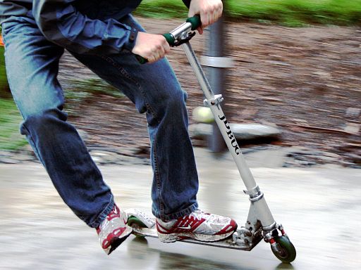 person riding a kick scooter