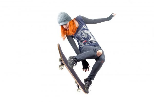A female can still show style in women's clothing for longboarding.