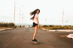 Skateboarder girl in the street