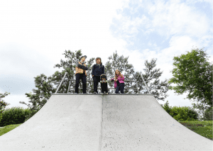 Children are enjoying this well-constructed vert board ramp.