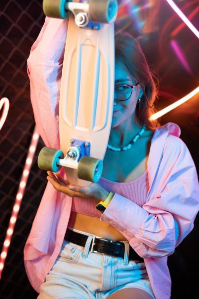 girl holding one of her best skateboard