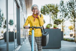  The woman on her scooter is on another phone call.