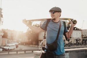 A skateboarder man with his skateboard