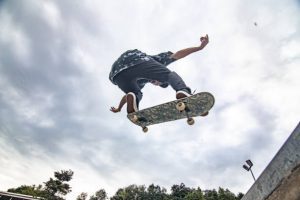 A skateboarder performing advanced skateboarding tricks. You can also learn how to do skateboarding stunts with practice.