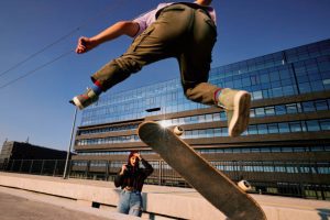 Skateboard riding and a camera.