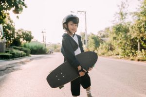 A young skateboarder ready for a ride.