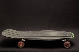 evolution of skating - every skaters skateboard with back background and strong wheels