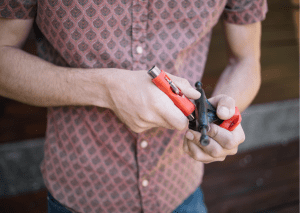 Person maintaining an important part of the skateboard. 