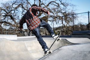 Composite skateboards. A man demonstrating his ability