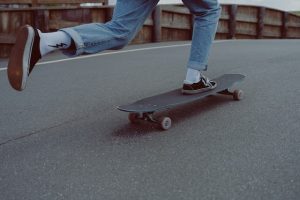 A skateboarder mastering his skills. 