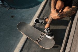 Resting beside a custom 'Zero' skateboard.