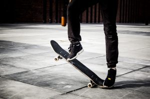 A tilted skateboard deck. Mastering the Ollie on a skateboard requires practice, timing, and coordination, but it opens the door to a wide range of advanced maneuvers and creative possibilities in this sport.