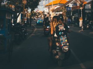 Teen carrying a skateboard