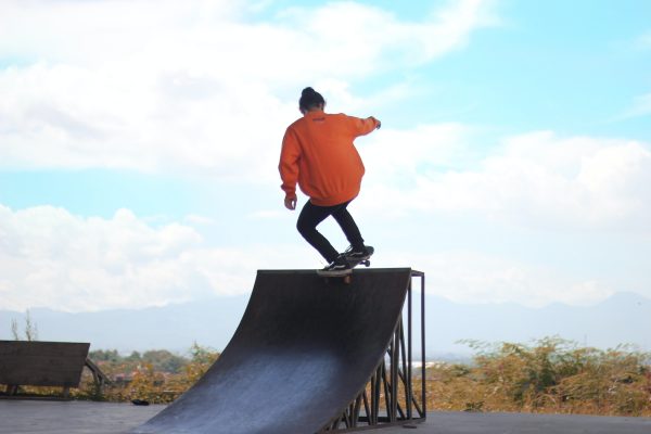 Making fun when creating best ramp in your streets. Man using his homemade wedge