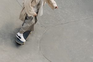 A person is skateboarding without a gear for protection